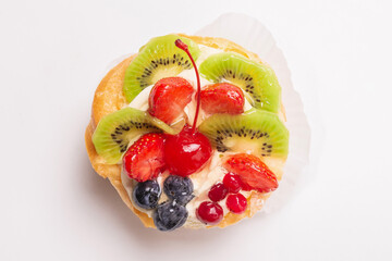 Home made cake with cream and fruits isolated.