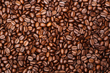 Top view of brown roasted coffee beans, can be use as background, copy space for text.