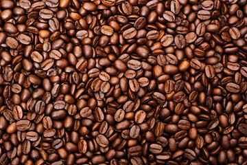 Top view of brown roasted coffee beans, can be use as background, copy space for text.