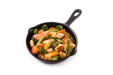 Stir fry chicken with vegetables on iron pan isolated on white background