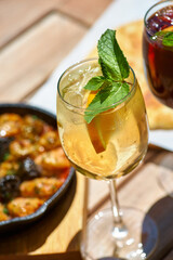 set of summer refreshments, three glasses of yellow lemonade. Bright sunny day.