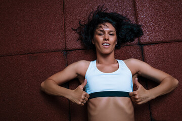 Fototapeta na wymiar Sport woman posing. Happy day. Fit woman. Motivation. Energy. 