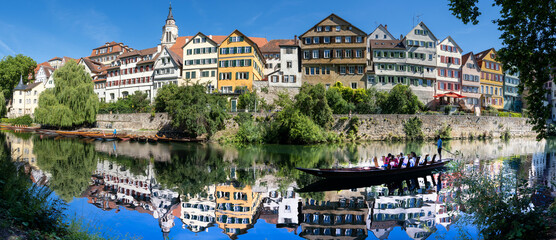 Fototapeta na wymiar view of old town Tuebingen on the Neckar River with a Stocherkahn boat in the foreground