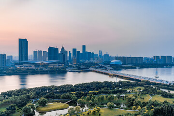 Dusk scenery of Shengjing Theater and urban buildings along the Hun River in Shenyang, Liaoning,...