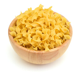 Yellow pasta in wooden bowl on white