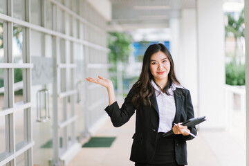 Beautiful young asian woman  holding tablet pc