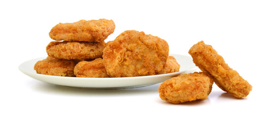 Macro of fried chicken nuggets in white plate on white background