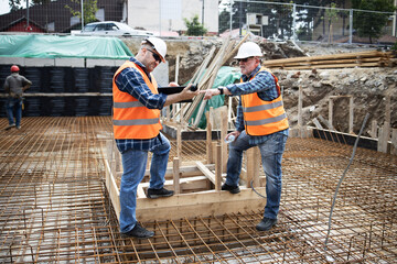 Managers, engineers discuss the further process of work on the construction site