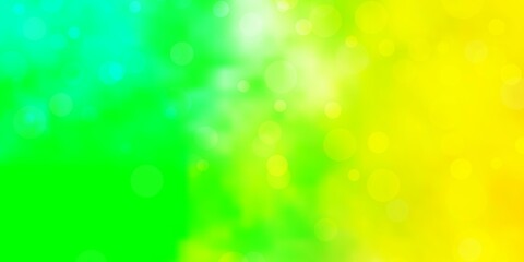 Obraz premium Light Green, Yellow vector backdrop with circles. Glitter abstract illustration with colorful drops. Pattern for websites, landing pages.