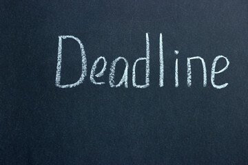 
The inscription on a dark blackboard deadline. A common phrase among businessmen and freelancers