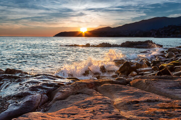 Obraz premium Sanremo sunset (Liguria, Italy, Italia). Sunset on a coastal city view, seascape, cityscape.