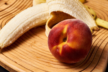 bananas, peaches are on the table