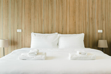 Fototapeta na wymiar Clean hotel bedroom wooden wall vintage retro cozy style