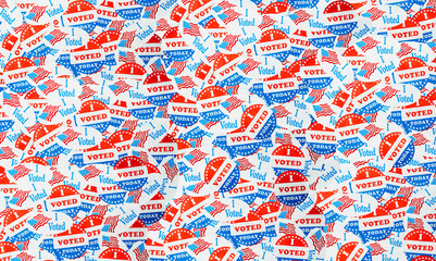 Many voting stickers given to US voters in Presidential election for background to illustrate vote...