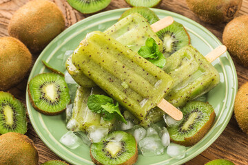 Kiwi ice cream popsicle on top of wooden board background