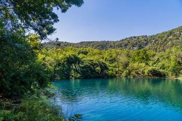 Fototapeta premium Shimmering blue lake inside Krka National Park, Dalmatia, Croatia