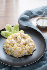 Delicious Fried rice with crab meat, egg, garlic, cucumber, lemon. Thai food called Khao pad poo.