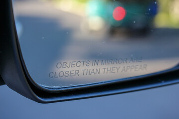 Objects in the mirror are closer than they appear