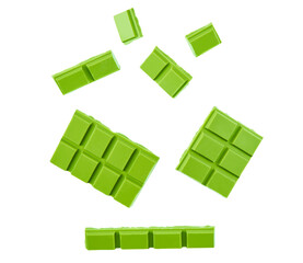 Fototapeta na wymiar green chocolate pieces isolated on white background, top view. flying mint chocolate pieces isolated on white background, close-up.