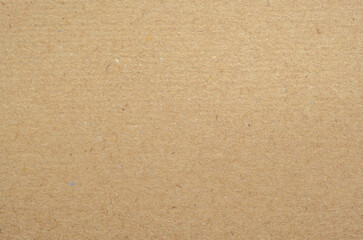 Texture of brown craft or kraft paper background, cardboard sheet, recycle paper, copy space for text.