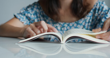 Woman read book at home