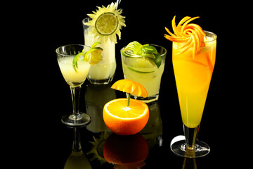 tropical drinks photographed on a dark glass table