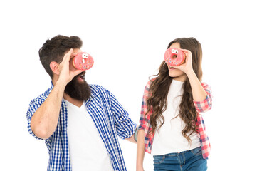 Cheerful family. Sweets and treats concept. Daughter and father eat sweet donuts. Dessert....