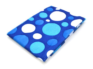 Spot blue folded tablecloth isolated