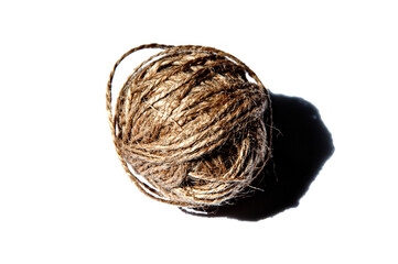 Ball of twine. Close up. Isolated. Hard light