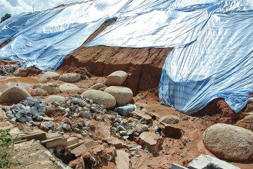 SEREMBAN, MALASIA - MARCH 3, 2019: The plastic sheet is spread over the surface of the slope to prevent erosion. Also to temporarily stabilize the slope before the permanent stabilization work done.