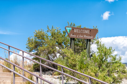 Jensen, USA - July 22, 2019: Welcome sign at Musket Shot Springs Scenic Overlook turnout in Utah Bureau of Land Management with steps stairs near Dinosaur National Monument