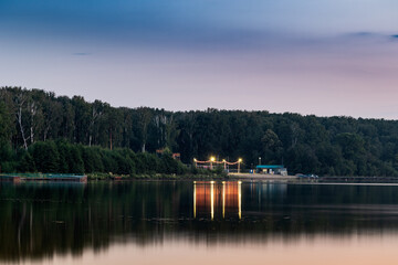 Fototapeta na wymiar Evening view from the shore of Lake Uvilda.