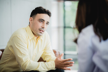 Close-up of psychologist comforting his depressed patient, mental health concept