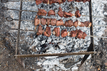 barbecue in the open air. cooking meat on fire