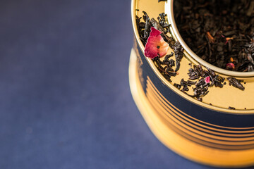 Closeup from above of a tin with tea leaves in it