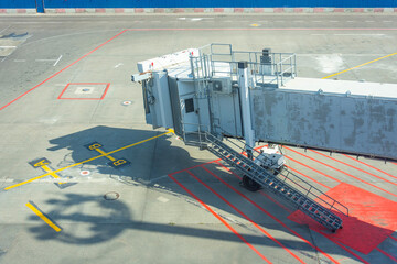Jet bridge on an airport terminal, empty gate.