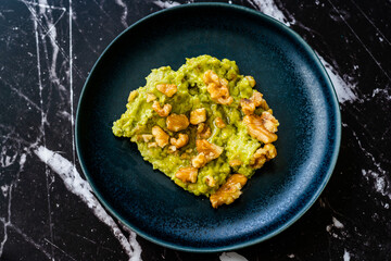 Mashed Avocado Puree Dessert with Walnut and Honey.