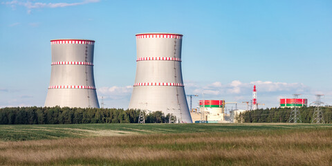 Cooling towers of nuclear power plant against the blue sky