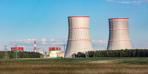 Cooling towers of nuclear power plant against the blue sky