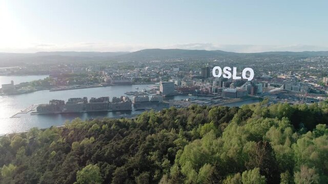 Aerial view of Oslo cityline with 3D title inscription behind Barcode buildings