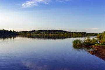 calm river in the countryside on a summer evening