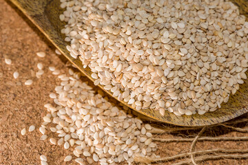 sesame seeds on wooden background, organic sesame seeds