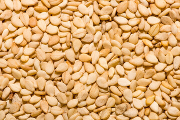 sesame seeds on wooden background, organic sesame seeds