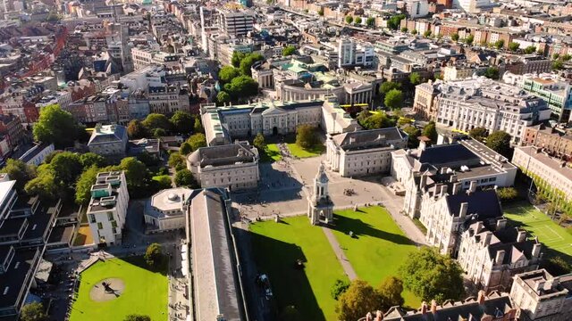 Trinity college aerial orbit tilt up reveal the city centre of Dublin.