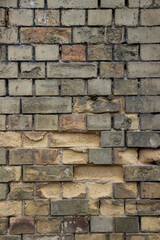 Eroded brick wall with broken parts.