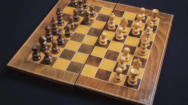 Chess game stop motion - with camera revolve around the chessboard. Strategy and strategic planning concept.