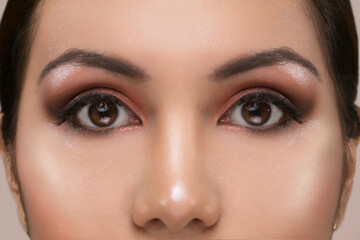 Fototapeta premium close up of a face with professional makeup and open eyes, details, studio