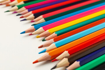 Colorful pencils on white background, close up