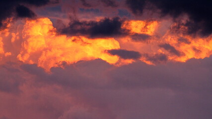 Colorful cloud patterns with golden hour light.