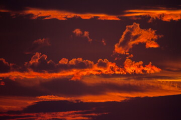 Colorful cloud patterns with golden hour light.